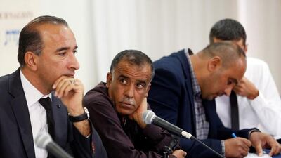Hussein Dawabsheh, second from left, the grandfather of Palestinian toddler Ali Dawabsheh who was killed together with his parents in an arson attack on their home in the occupied West Bank in 2015, at a news conference in Tel Aviv, Israel, on May 8, 2017. Nir Elias / Reuters