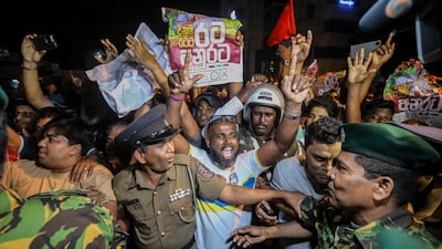 Supporters of President-elect Anura Kumara Dissanayake cheer outside the Election Commission in Colombo, Sri Lanka. EPA