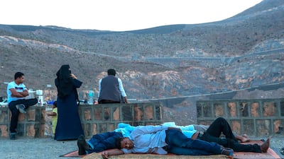Weekend mountain lovers still asleep at the break of dawn at the Jebel Jais mountain picnic area. Victor Besa/The National