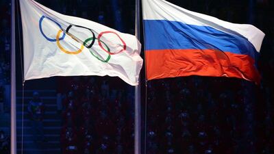 The Olympic and Russian flags during the Opening Ceremony of the Sochi Winter Olympics on February 7, 2014 in Sochi. AFP