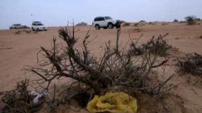 Volunteers drive in the desert to collect rubbish and advise campers and off-road motorists on the best way to preserve the environment.