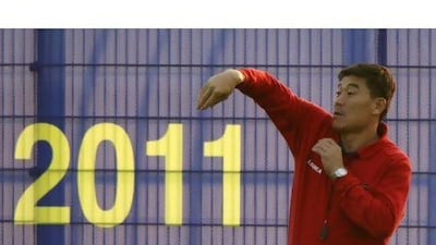 North Korea's coach Jo Tong-sop instructs his players during training this week. Jo Yong-Hak / Reuters