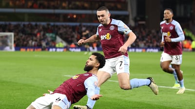 Douglas Luiz of Aston Villa celebrates with teammate John McGinn after scoring his team's first goal. Getty Images