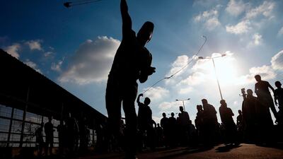A Palestinian protestor hurls a rock during a demonstration at the Erez crossing with Israel. AFP