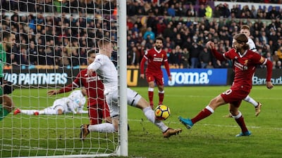 Adam Lallana, right, in action for Liverpool against Swansea City. Matthew Childs / Reuters