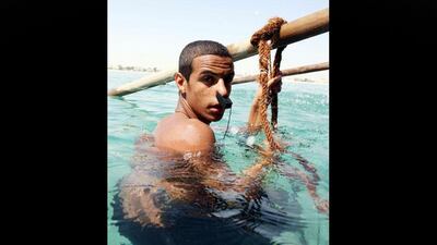 A Kuwaiti diver takes part in a pearl diving festival in the port of Khairan. Yasser Al Zayyat / AFP Photo