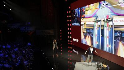 Creative director Charles Huteau at Ubisoft Montreal plays Shape Up as Aisha Tyler watches while introducing the game. Dan Krauss / Getty Images / AFP