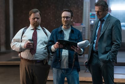 Drector Akiva Schaffer, centre, with Paul Walter Hauser, left, and Neeson. Photo: Paramount Pictures