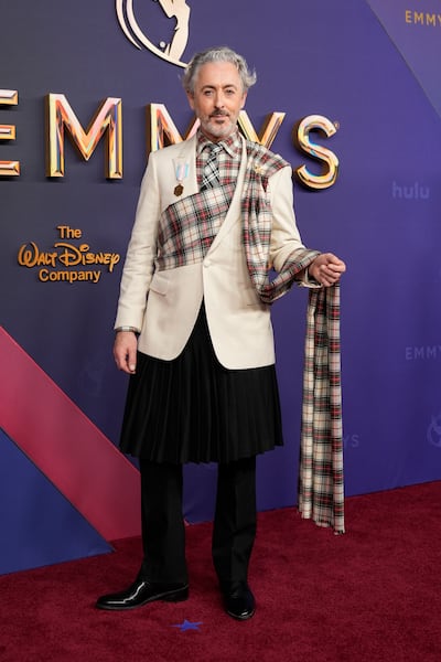 Alan Cumming wears Teddy Vonranson. AP