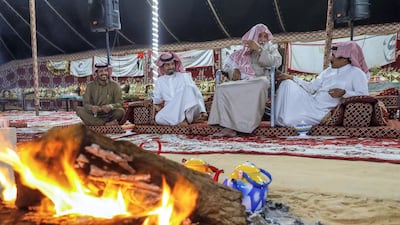 Men of the Dawasir tribe from Saudi Arabia relax after a victory at the Al Dhafra Festival in Abu Dhabi, UAE. Victor Besa / The National