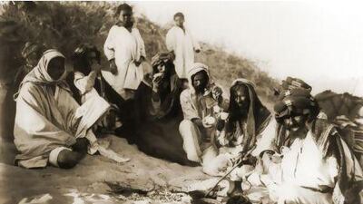 then a photo by traveler Hermann Burchardt of tribes pausing for coffee break in the desert between Hufuf and Qatar dating 1904 Courtesy National Center for Documentation and Research.