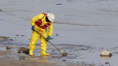 About 69,000 feet of oil-absorbing boom have been placed around the site of the spill and along sensitive shorelines, according to the US Coast Guard. Thomas Shea / Getty Images / AFP