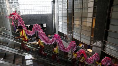 Dragon and lion dancers perform at the trading floor of the Philippine Stock Exchange to start the first day of trading for the Lunar New Year. Francis Malasig / EPA