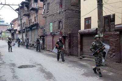 Indian paramilitary soldiers patrol a deserted street during the second phase of India's general elections in Srinagar, Indian administered Kashmir. AP Photo