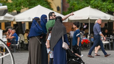 Tourists from the Middle East in Krakow, Poland. Gulf residents could face much higher costs for overseas holidays due to movements in the US dollar. Getty Images