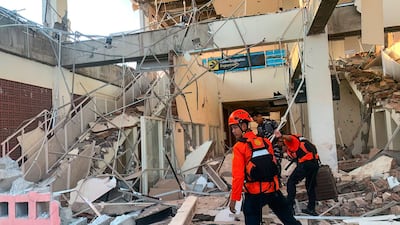 Rescuers search for survivors in Maumere, East Nusa Tenggara province. AFP