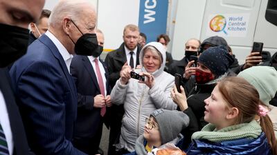 Mr Biden talks to children of Ukrainian refugees. Reuters