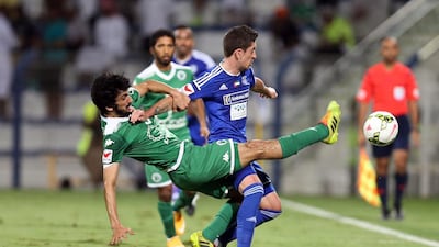 Al Shabab's Manei Mohammed, left, stretches for the ball during an Arabian Gulf League match against Al Nasr at Al Maktoum stadium in Dubai on February 12, 2015. Ashraf Al Amra / Al Ittihad