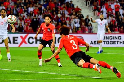 South Korea defender Kim Jin-su heads the ball to score the winning goal at the end of the first period of extra time. AFP