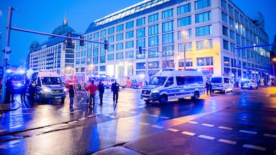 Emergency vehicles block the street in central Berlin. AP