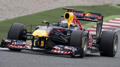 Sebastian Vettel sits in his car waiting to practise. After crashing, he sat in the garage watching the rest of the practice.