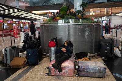 Stranded passengers wait at Istanbul airport. AFP