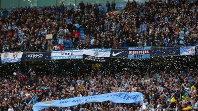 Manchester City fans show their support prior Sunday's win over West Ham United that earned the club the 2013/14 Premier League title. Alex Livesey / Getty Images