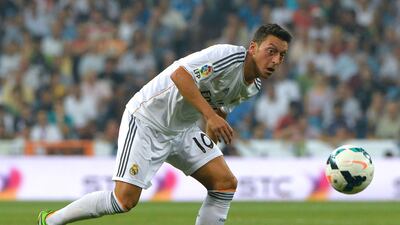 Mesut Ozil, Real Madrid's German midfielder, was stunningly signed by Arsenal for a club-record €50m. Gerard Julien / AFP