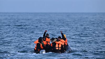 Migrants travel in an inflatable boat across the English Channel, bound for Dover on the south coast of England. AFP