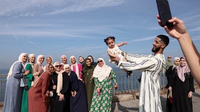 People take a picture celebrating the Eid Al Adha in New York City. Reuters