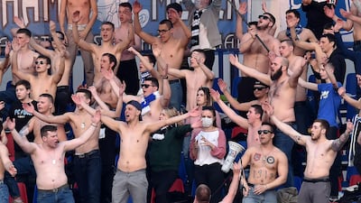 Fans of FC Minsk support their team during the Belarus Championship match between FC Minsk and FC Dinamo-Minsk. AFP