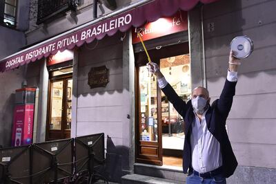A flashmob by shop owners in Turin, Italy, 28 April to draw attention to the problems of businesses that had to close due to the ongoing pandemic. Alessandro Di Marco / EPA