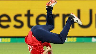 England's Dawid Malan tumbles after his successful catch to dismiss Australia's Marcus Stoinis. AFP