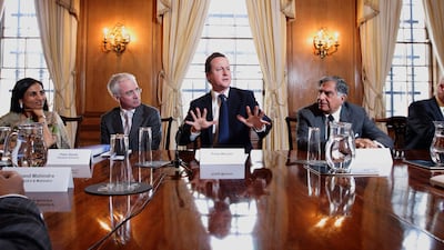 Mr Tata, right, at the UK-India CEO Forum chaired by then-British prime minister David Cameron at Downing Street in 2011. AFP