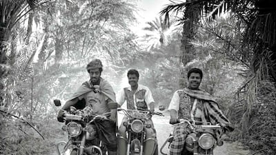 Max Pam's cinematic photograph of men on motocycles in a jungle, which is part of the Ramadan in Yemen exhibition. Courtesy Max Pam
