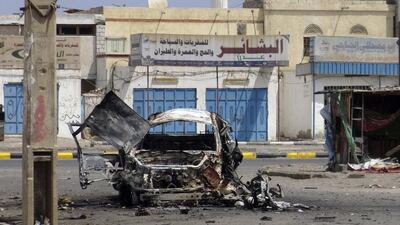 A destroyed car is seen on a street of the Al Mansoura neighbourhood of Yemen's southern port city of Aden March 13, 2016 after heavy overnight clashes with suspected Al Qaeda militants. Fawaz Salman/Reuters