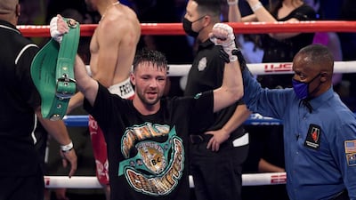 Referee Kenny Bayless hold up the hand of Josh Taylor. AFP