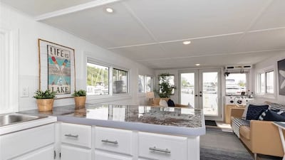 All rooms overlook the water on this Canadian houseboat. Photo: Zillow
