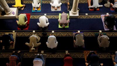 Muslims maintain social distance as they pray inside the Al-Azhar mosque during the first Friday prayers after reopening, in the old area of Cairo, Egypt. Reuters