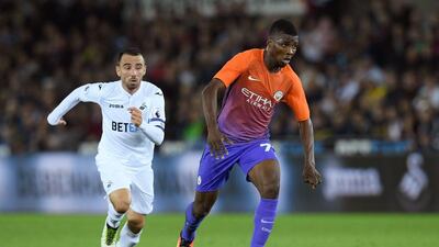 Kelechi Iheanacho of Manchester City evades Leon Britton of Swansea City during the League Cup. Stu Forster / Getty Images