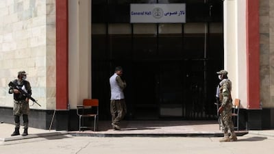 Taliban guards stand outside Kabul Education University in September. Getty