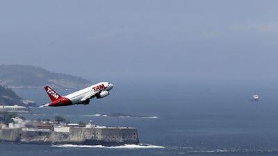 A TAM Airlines plane takes off from Santos Dumont airport in Rio de Janeiro. The airline has lost its licence to fly in Bolivia. Sergio Moraes / Reuters