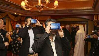 Members of the media try out the new Jumeirah Inside app, a virtual platform created by Jumeirah Group and Google that uses 360-degree video and photography to allow users to explore the Burj Al Arab in Dubai to see what the hotel has to offer and make hotel bookings. Photos Sarah Dea / The National