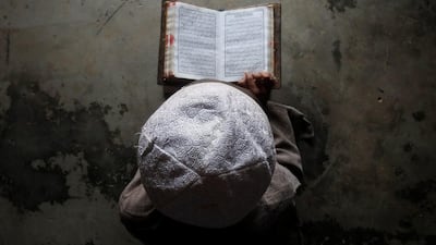 A Muslim boy learns to read the Koran at a madrassa, or religious school, during the holy month of Ramadan. Javanta Dey / Reuters