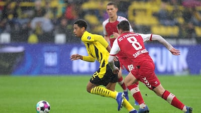 Dortmund's Jude Bellingham runs with the ball during the Bundesliga match against Freiburg. EPA
