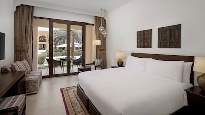 The master bedroom in a ground-floor suite is a few steps away from the swimming pool