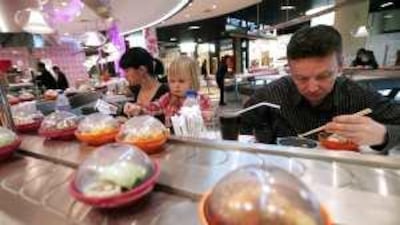 The group behind eateries like this Yo! sushi outlet in Dubai Mall plans to add 80 more restaurants in the region.