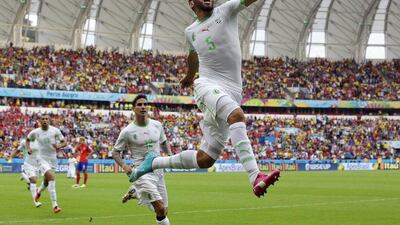 Algeria's Rafik Halliche celebrates after scoring his side's second goal during their 4-2 win against South Korea. Lee Jin-man / AP Photo