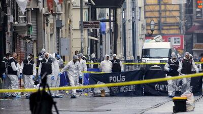 Police forensic experts inspect the area after a suicide bombing in a major shopping and tourist district in central Istanbul, Turkey (REUTERS/Huseyin Aldemir)