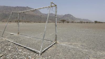 An abandoned football field in the village. Jeffrey E Biteng / The National
